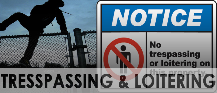 A sign that says No Trespassing or Loitering and a person jumping over a fence